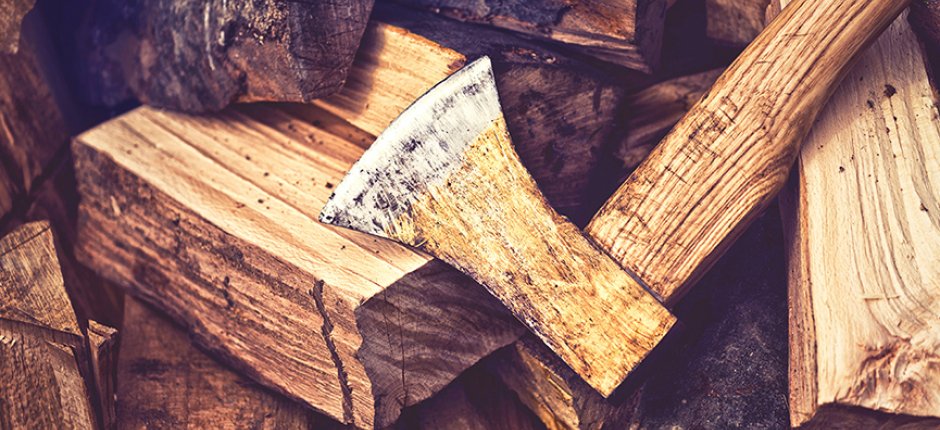 Chop wood with ax. Photo.