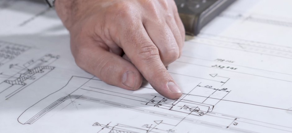 Hand poiting on Jøtul process drawings