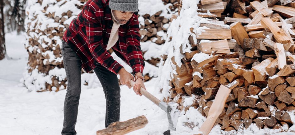 Man chopping wood in the winter
