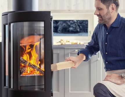 Man using his Jøtul wood stoves
