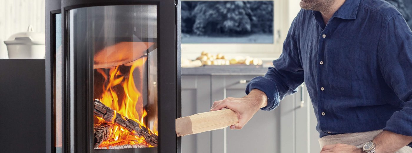 Man using his Jøtul wood stoves